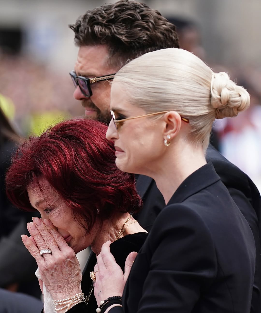 sharon-osbourne-is-comforted-by-her-children-jack-and-kelly-as-she-leads-ozzy-osbournes-funeral-1-1753944656.jpg